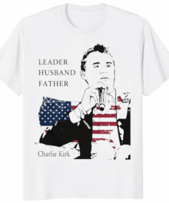 Charlie Kirk Leader Husband Father America Shirt in white featuring patriotic design with flag background and slogan Leader Husband Father.