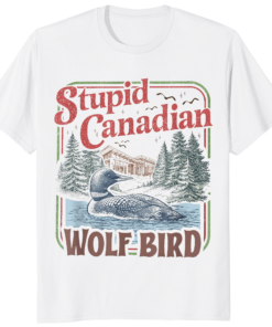 A premium Natural color Stupid Canadian Wolf Bird Heated Hockey Shirt featuring a vintage-style loon graphic with pine trees and lake scenery.