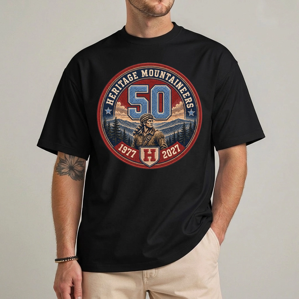 Heritage Mountaineers Shirt | 50th Anniversary 1977-2027 Tee 1 Heritage Mountaineers Shirt in black with a 50th anniversary varsity crest dated 1977 to 2027