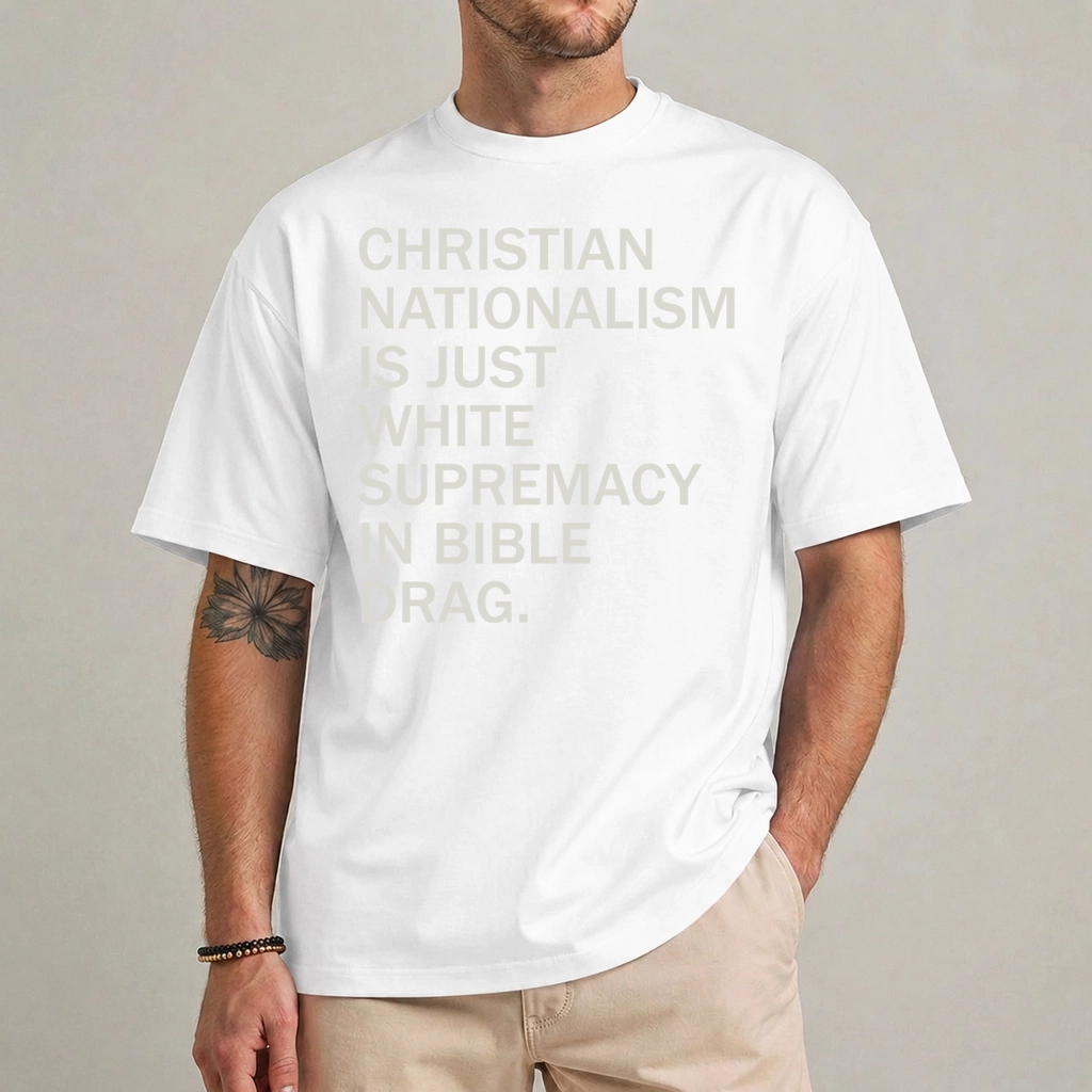 Anti Christian Nationalism Shirt | Bible Drag Slogan 1 Model wearing a white anti Christian nationalism shirt with pale stacked Christian Nationalism Is Just White Supremacy In Bible Drag lettering
