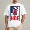 Model wearing a white Lane Kiffin Hoe shirt with a red-and-blue portrait and large red HOE caption