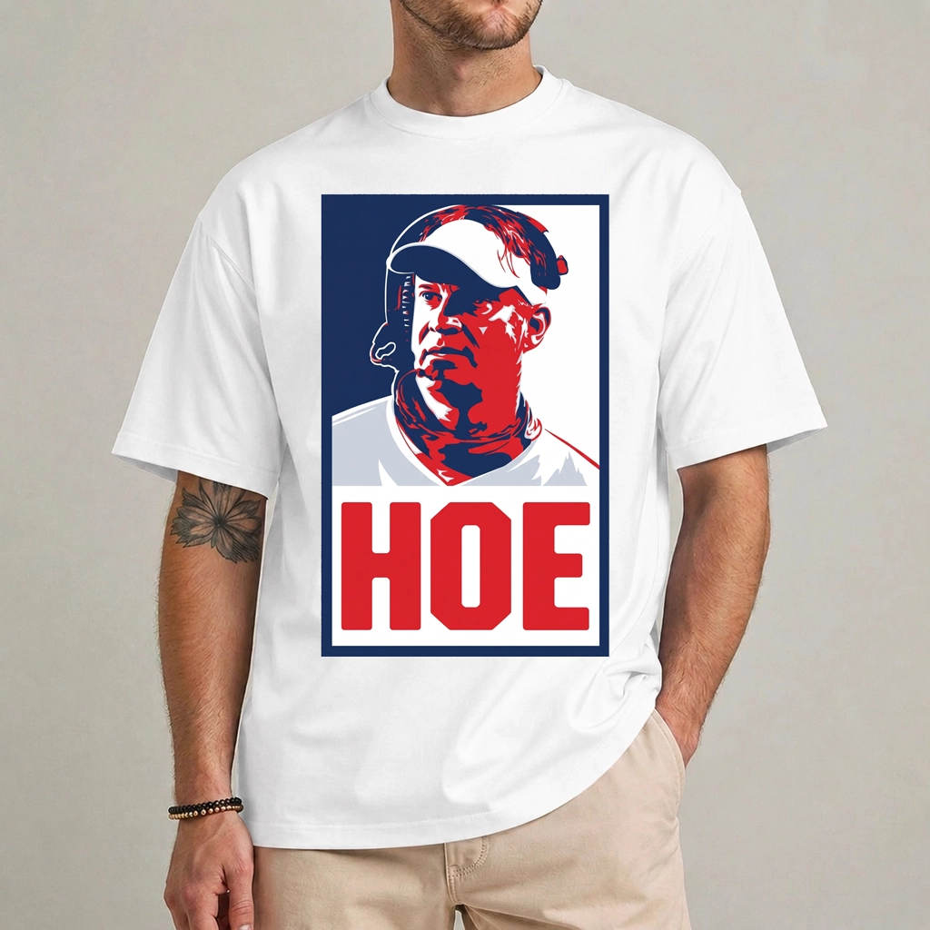 Lane Kiffin Hoe Shirt | Football Satire Graphic Tee 1 Model wearing a white Lane Kiffin Hoe shirt with a red-and-blue portrait and large red HOE caption