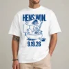 Model wearing a white Delaware Hens Win shirt with a blue mascot-style bathtub illustration and 9.19.26 date