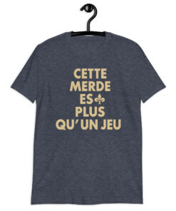 Cette Merde Est Plus Qu’un Jeu Saints Shirt 8 Heather navy shirt with stacked gold French slogan lettering and a fleur-de-lis beside ES, front view