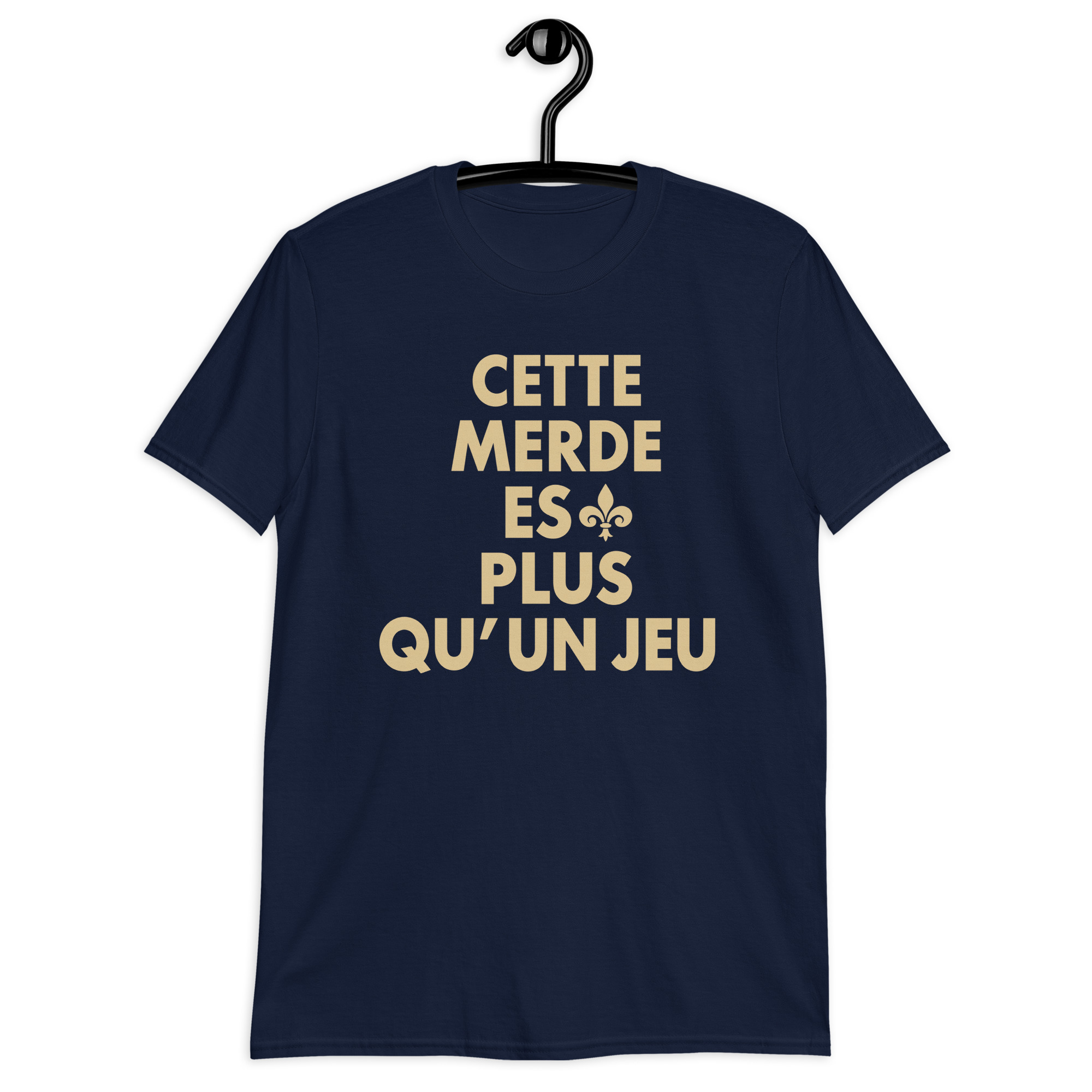 Cette Merde Est Plus Qu’un Jeu Saints Shirt 2 Navy shirt with stacked gold French slogan lettering and a fleur-de-lis beside ES, front view